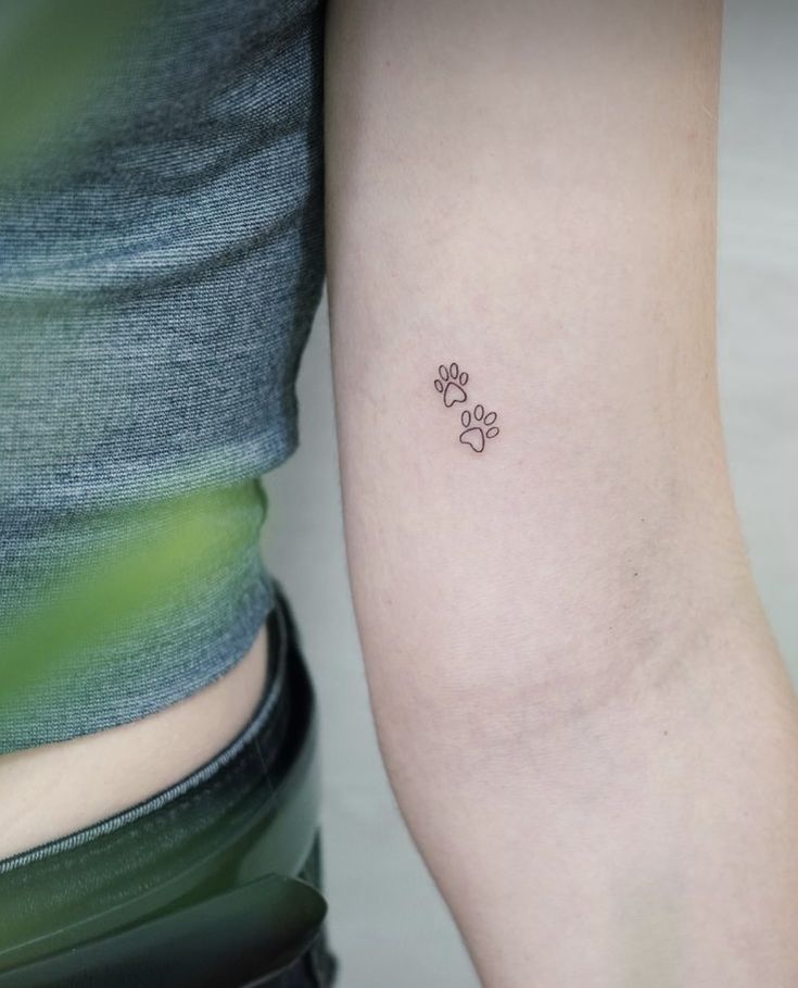 a woman with a small tattoo on her arm