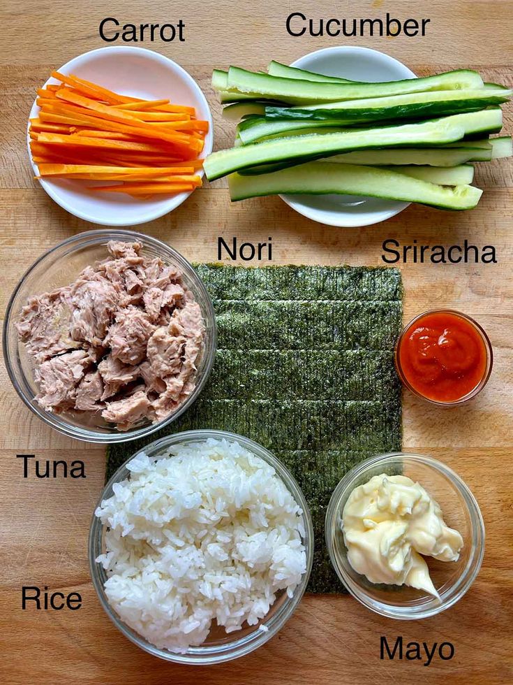 the ingredients for this meal include carrots, cucumber, nori, and rice