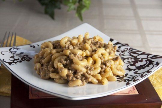 a white plate topped with macaroni and cheese