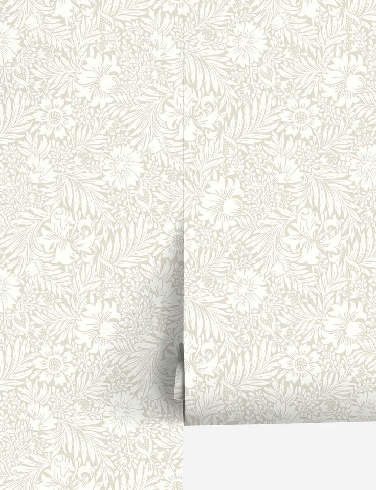 a white wallpaper with an intricate design on it's side and the bottom half