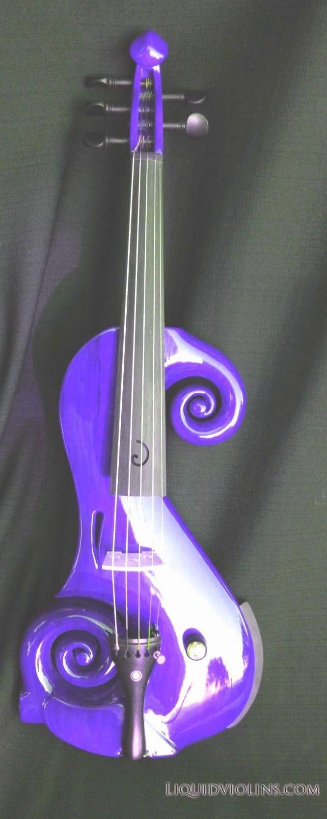 a purple violin is sitting on a black background