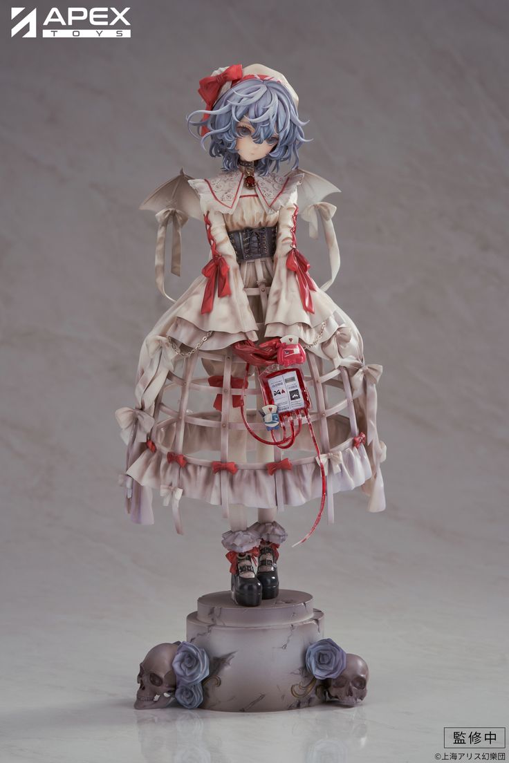 an anime figurine is posed on top of a white surface with red accents