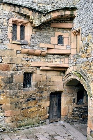 an old stone building with arched doorways