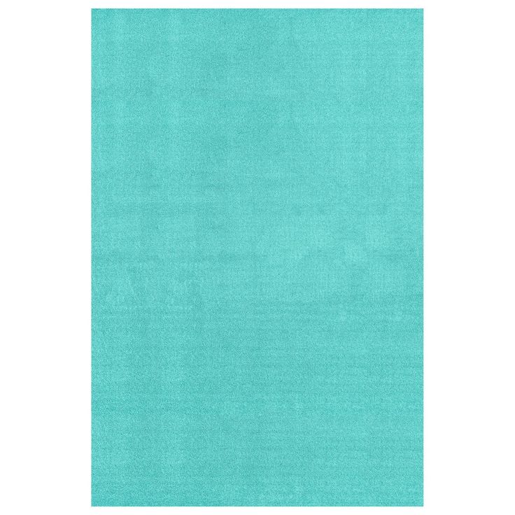 an aqua blue rug with white border