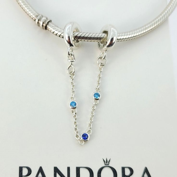 Pandora Triple Blue Stone Safety Chain Charm For Pandora Bracelet # 791688C01 New and never used  ALE / S925 on it  Sterling Silver Bracelet for display only Pictures taken from actual item Comes with Official Pandora cartoon box,tissue paper and seal PAYMENT: We accept credit cards, debit cards, and e-checks through payment system. Payment is due within 3 days, but immediate payment is greatly appreciated. SHIPPING: Item available now ready to go I can ship out as soon as possible mostly same d Sterling Silver Chain Jewelry In Blue, Sterling Silver Blue Chain Jewelry, Pandora Charms Blue, Blue And Silver Pandora Bracelet, Blue Sterling Silver Charm Bracelet With Lobster Clasp, Nickel-free Blue Charm Bracelet For Gift, Pandora Blue Butterfly Charm, Pandora Blue, Safety Chain