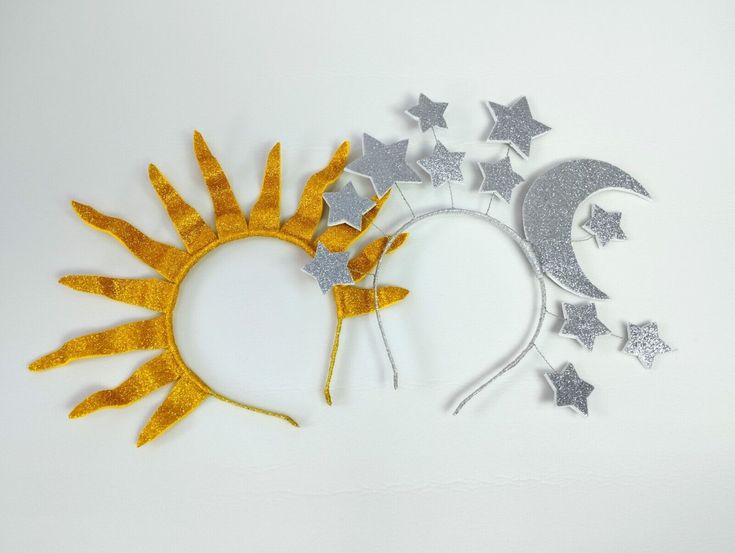 the sun and moon headbands are made out of glittery paper with silver stars