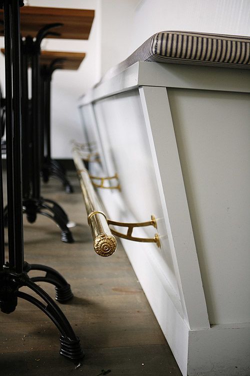 a row of chairs sitting next to each other on top of a wooden floor