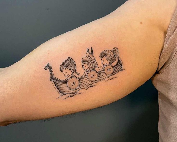 a woman's arm with three children in a row boat tattoo on the left upper arm