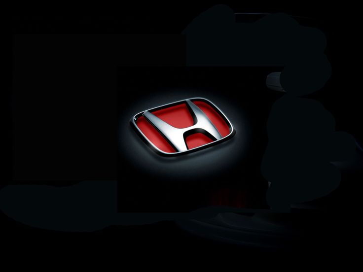 the honda logo is lit up in the dark