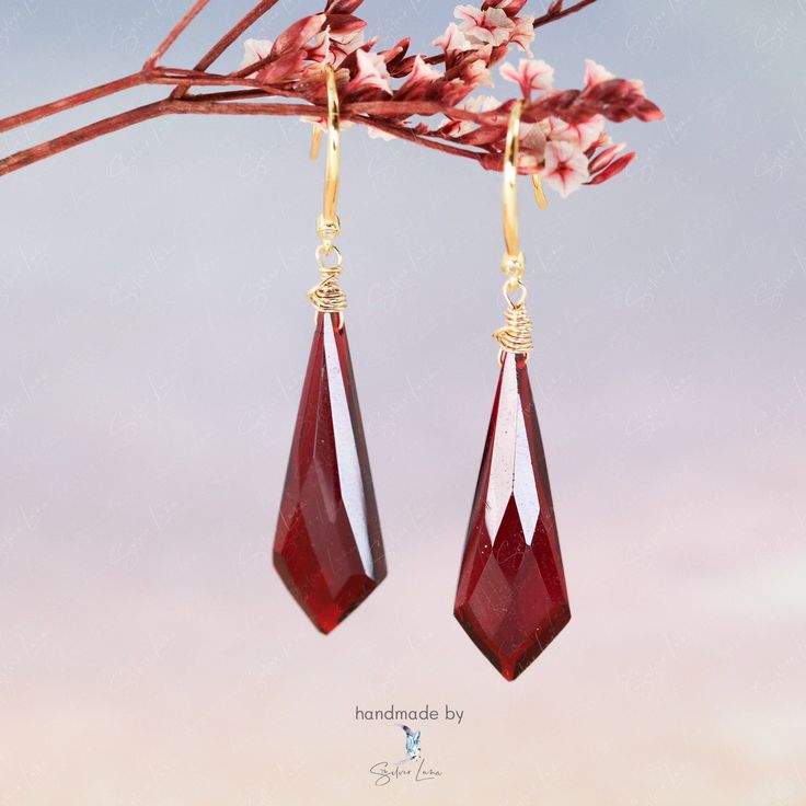 Experience the elevated style of our Kite red garnet natural stone drop earrings. These handcrafted earrings feature genuine garnet stones in a kite shape, bringing sophistication and energy to any outfit. The translucent red stones are known for increasing passion and vitality, making them an ideal gift for yourself or a loved one. Elevate your fine jewelry collection with these one-of-a-kind kite red garnet dangle earrings. You can choose metal finish options: Silver: will have solid 925 sterl Red Drop Crystal Earrings As Gift, Elegant Red Drop Crystal Earrings, Red Ruby Drop Earrings, Elegant Garnet Drop Earrings, Red Garnet Dangle Earrings, Elegant Garnet Teardrop Earrings, Elegant Faceted Garnet Earrings, Elegant Handmade Burgundy Jewelry, Red Drop Earrings