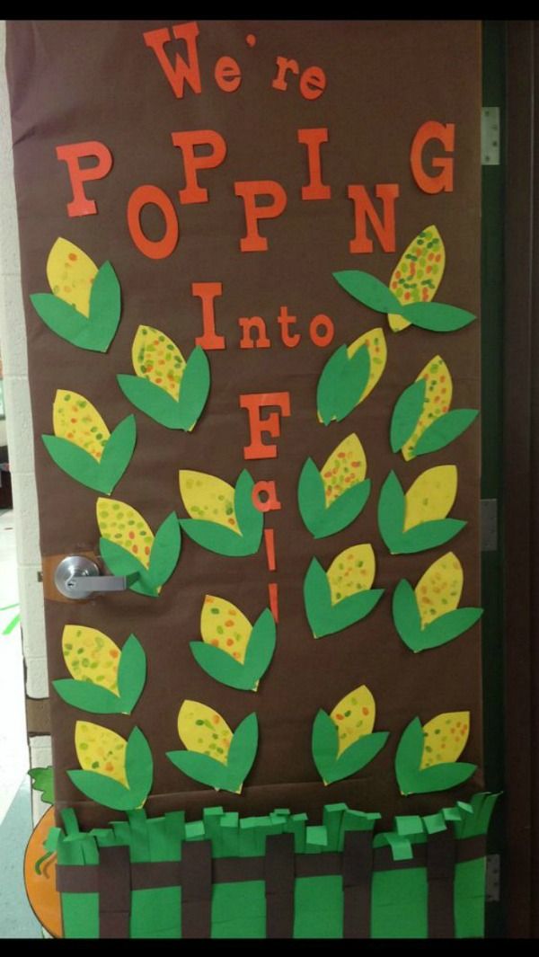 a door decorated with corn on the cob and we're popping into it