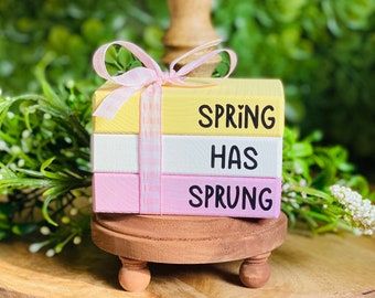 a small wooden box that says spring has sprung on it