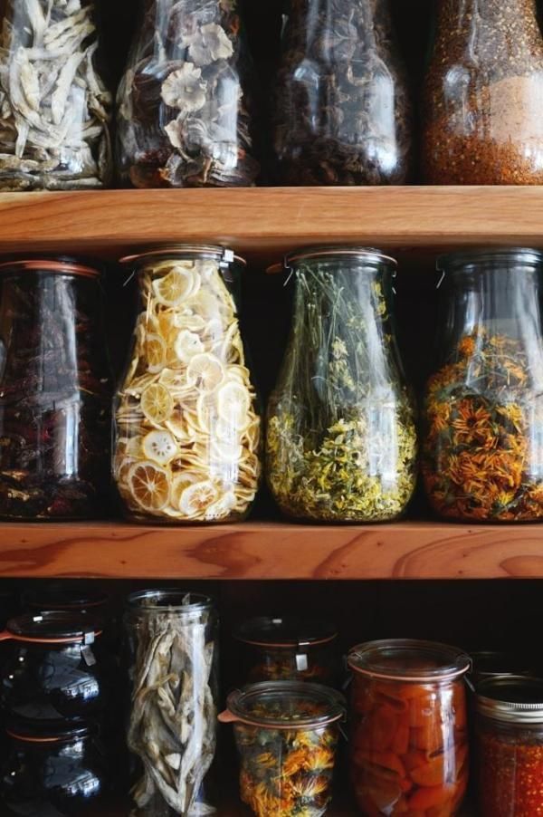 many jars filled with different types of food