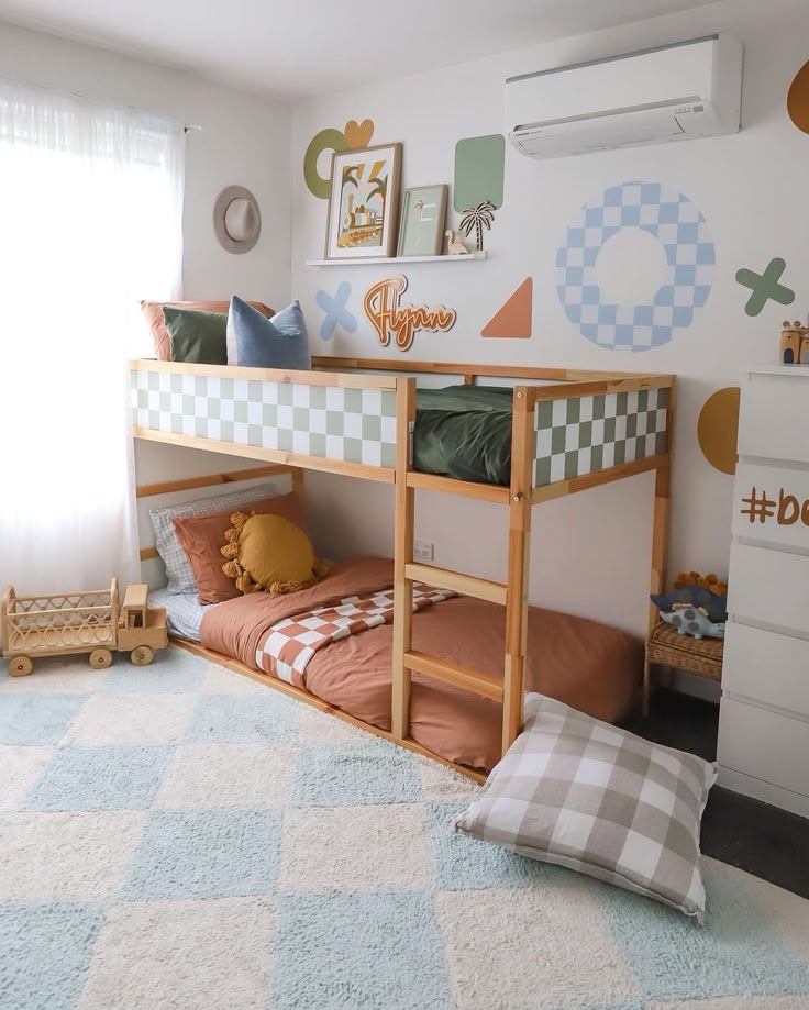 a child's bedroom with a bunk bed and checkered rug