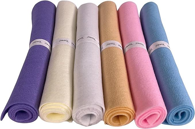 five different colors of yoga mats lined up in a row on a white background with one rolled up and the other rolled down