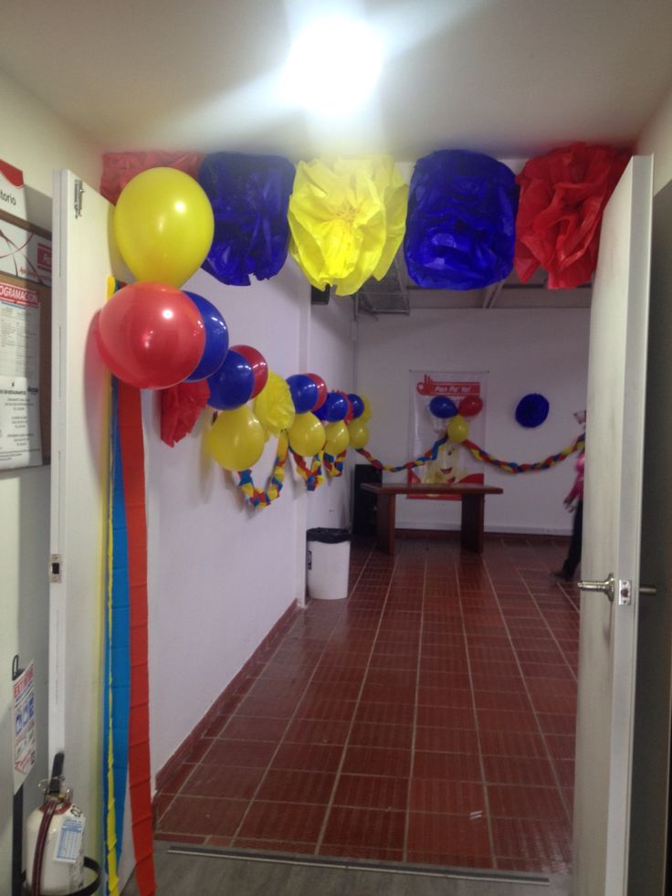 the hallway is decorated with balloons and streamers