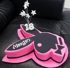 a pink and black birthday cake with stars on it