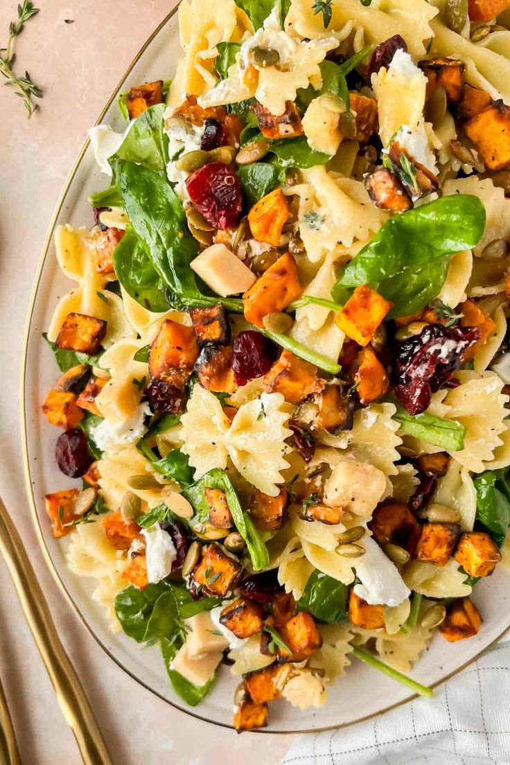 a white plate topped with pasta salad