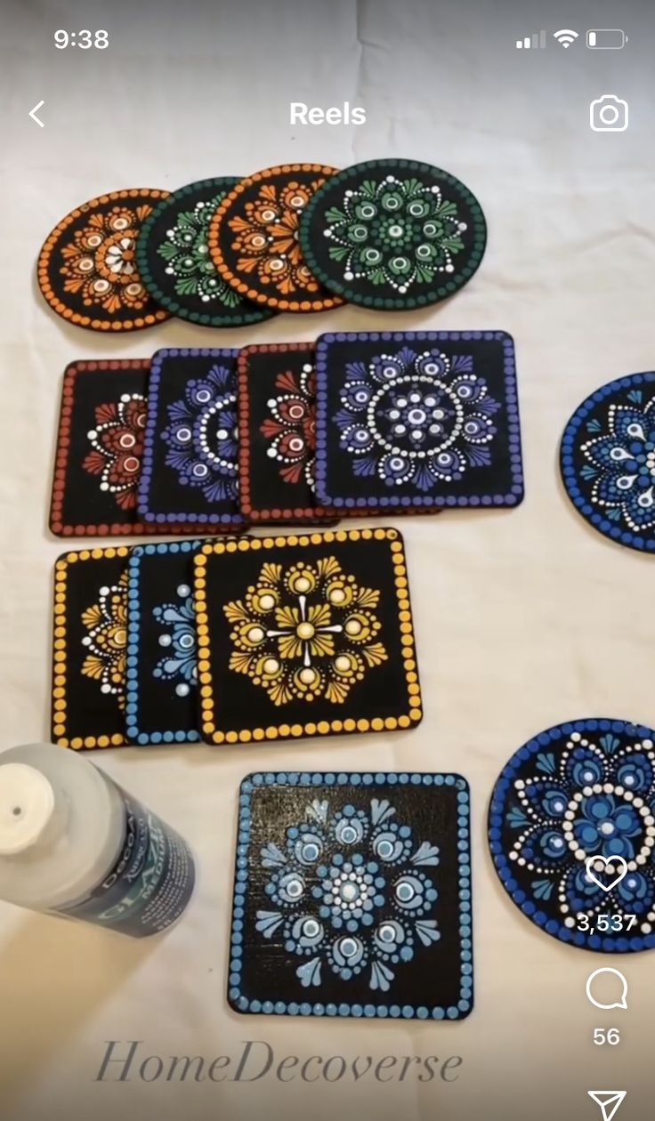 several coasters with beaded designs on them