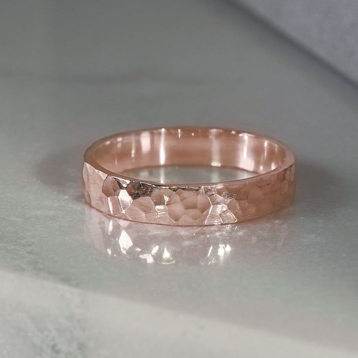 A classic design, with interest added using a hammer finish to catch every gleam of light. Made in SCS recycled rose gold, a versatile every day ring or striking addition to a wedding set. Design Specifications: - Type: Ring - Material: SCS recycled rose gold - Width: 3.5mm - Thickness: 1.2mm - Finish: Hammered | Polished - Profile: Flat Wedding Set Design, Rose Gold Band Ring, Gold Rings Simple, Hammered Rings, Rose Gold Wedding Bands, Everyday Rings, Rose Gold Band, Rose Gold Jewelry, Wedding Set