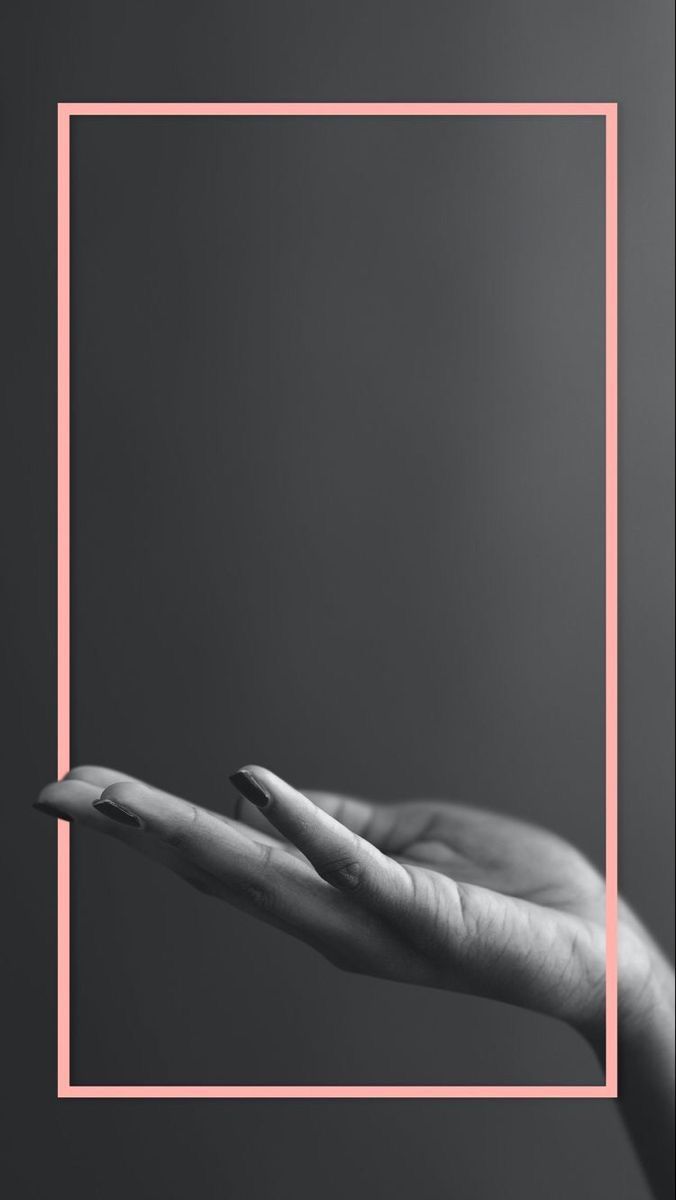 two hands holding each other in front of a pink square frame on a black background