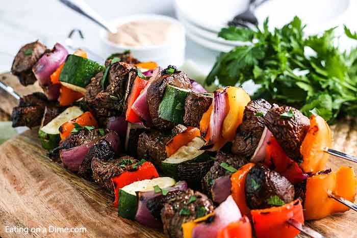 steak kabobs on a cutting board with the title easy steak kabobs