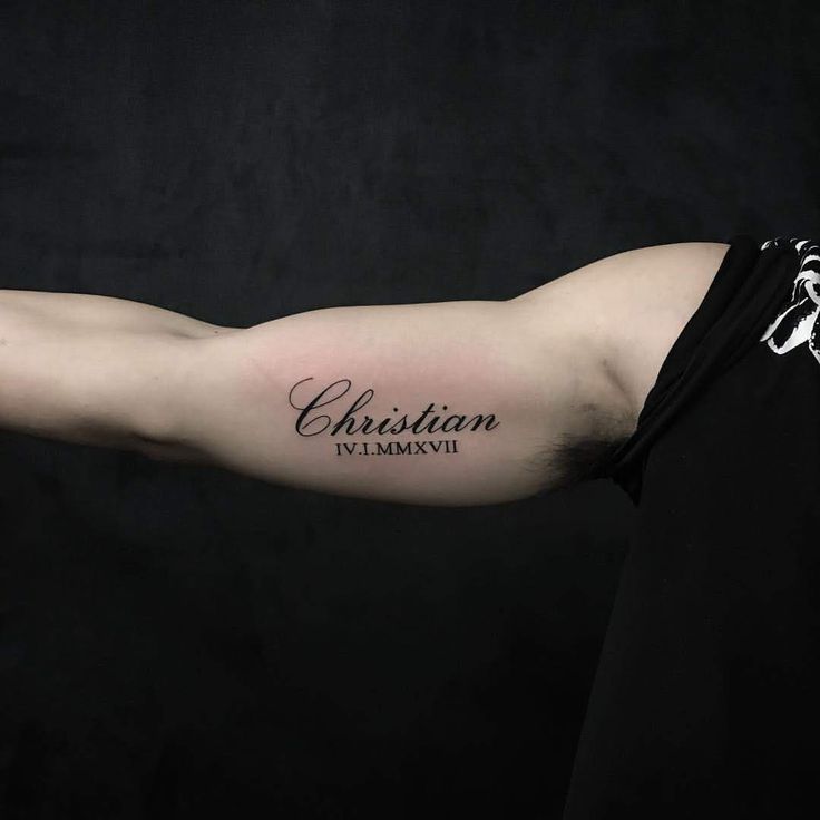 a man with a tattoo on his arm that reads christian and the word, vlammavi