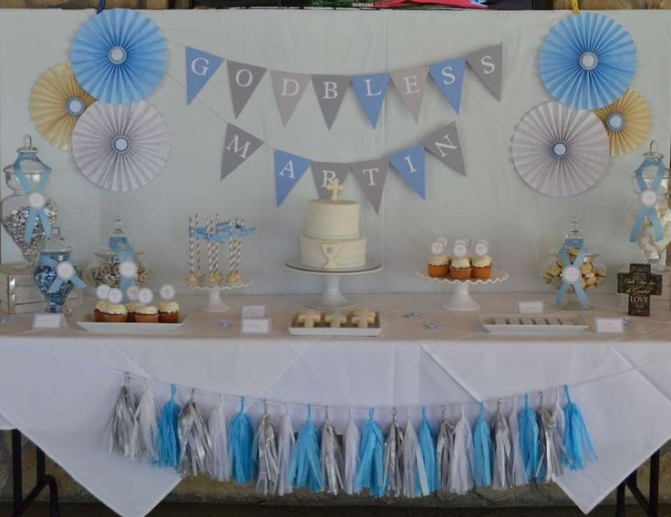 a table with cake, cupcakes and decorations on it