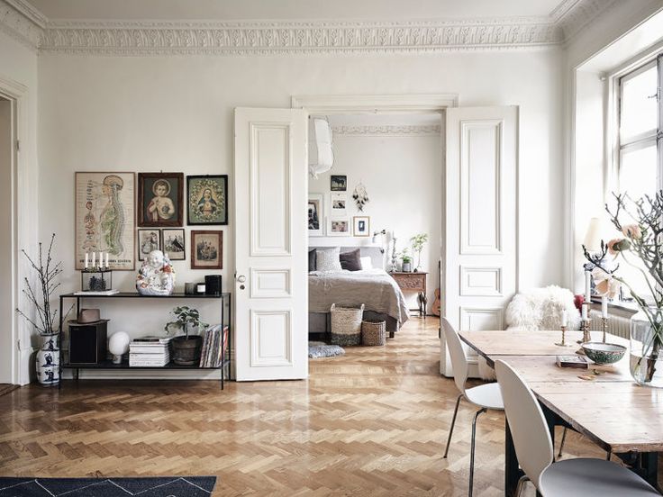 a room with white walls and wooden floors