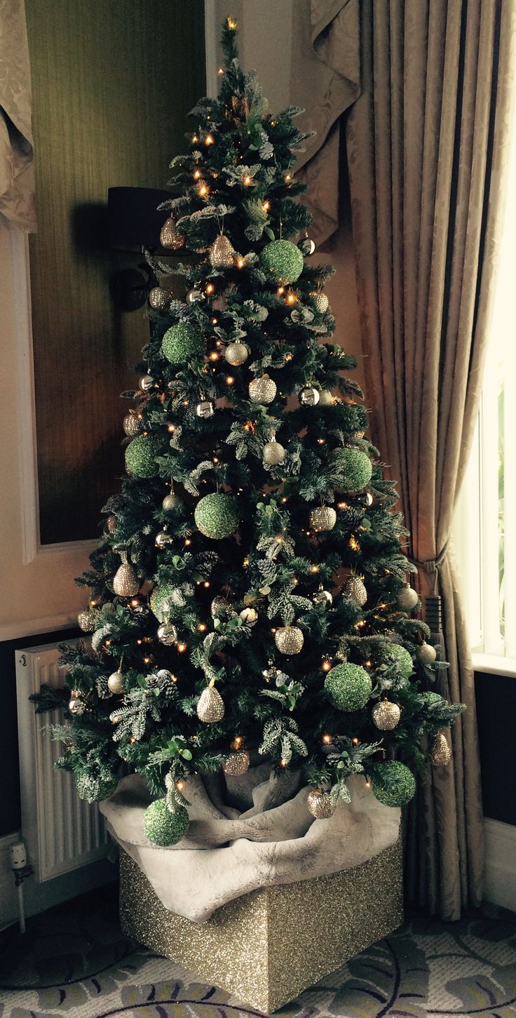 a decorated christmas tree in a living room