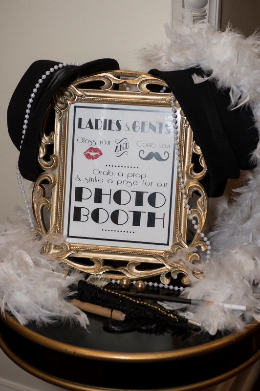 a photo frame with some feathers around it and a sign that says, ladies gen