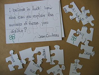 a piece of paper that has been made into puzzle pieces with words written on it