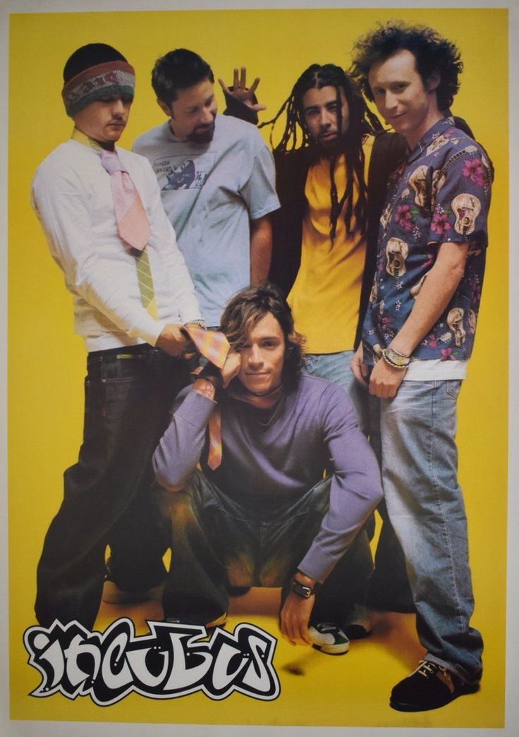 a group of men standing next to each other in front of a yellow background with the word south written on it