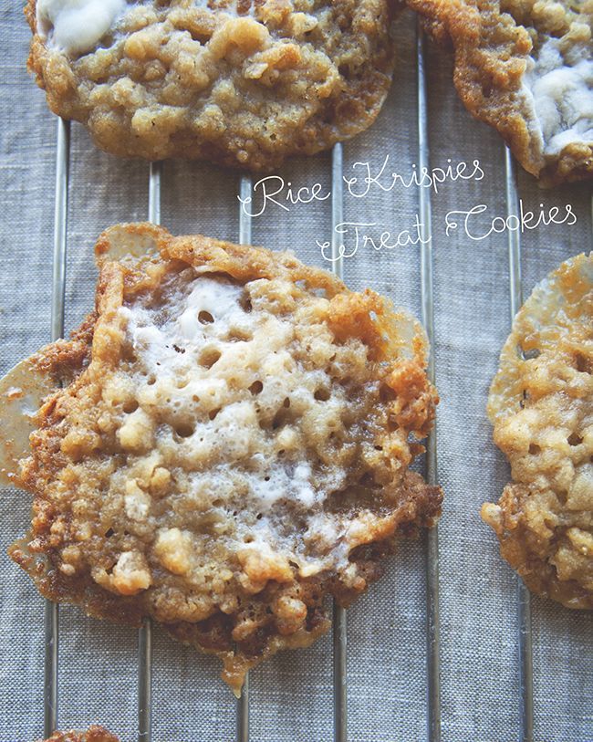 several cookies are cooling on a rack with icing and crumbs all over them