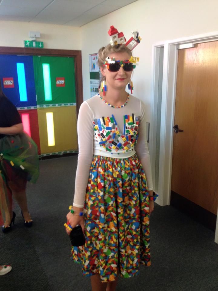 a woman in a colorful dress and sunglasses