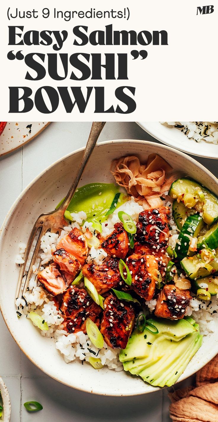 a bowl filled with rice, cucumber and salmon on top of a table