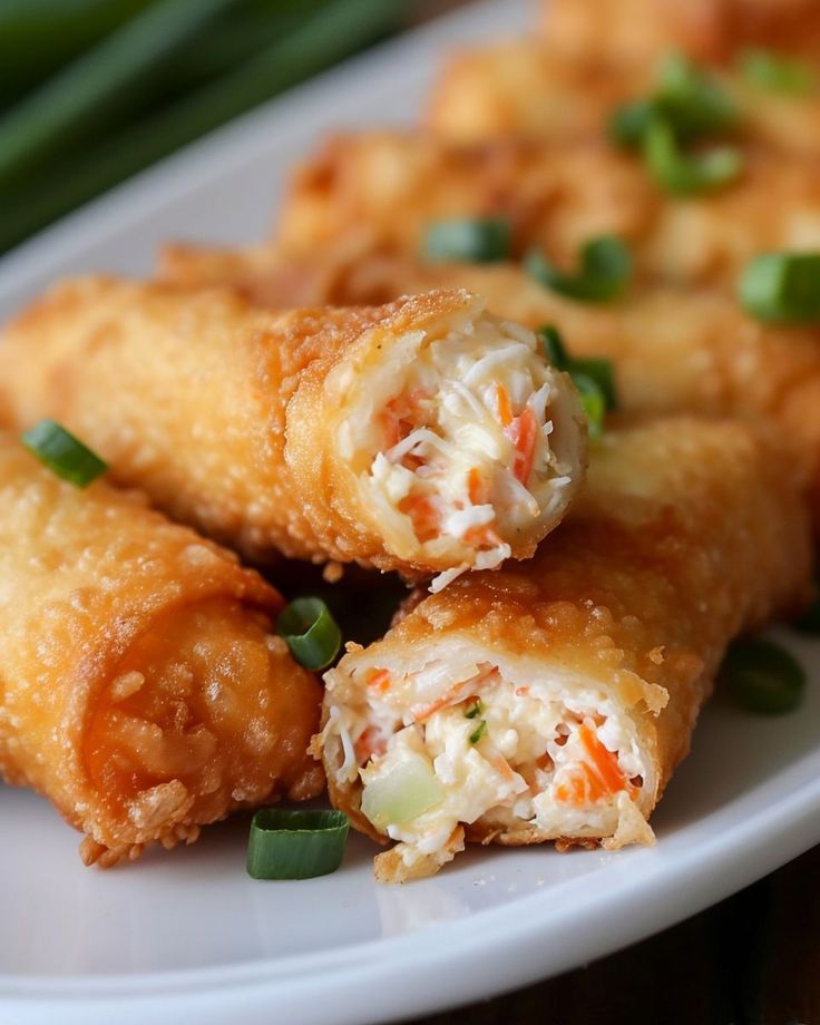 some food on a white plate with green onions