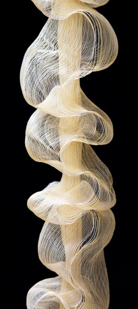 an abstract sculpture made out of white thread