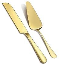 two gold colored utensils sitting next to each other