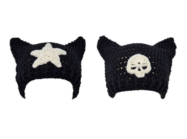 two crocheted hats with skulls and stars on the top one has a cat's head