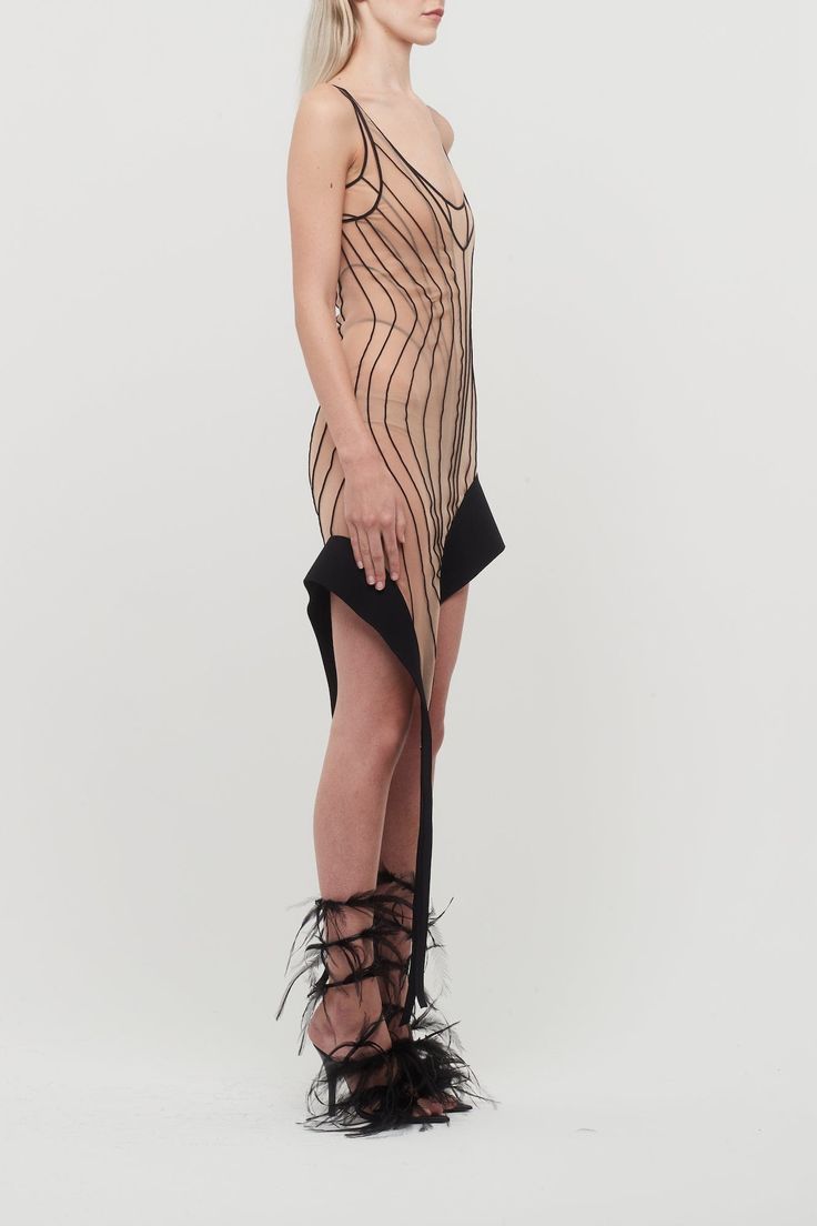 This dress from Mugler's Spring/Summer 2024 collection features anatomical seams, an integrated bodysuit, and a black spike hemline. Avant-garde Fitted Evening Dress, Fitted Black Mini Dress With Structured Boning, Summer Night Out Dress With Structured Boning, Fitted Black Dress For Fashion Events, Fitted Mini Dress With Asymmetrical Hem For Evening, Fitted Asymmetrical Hem Evening Mini Dress, Avant-garde Fitted Black Dress, Laquan Smith, Charlotte Chesnais