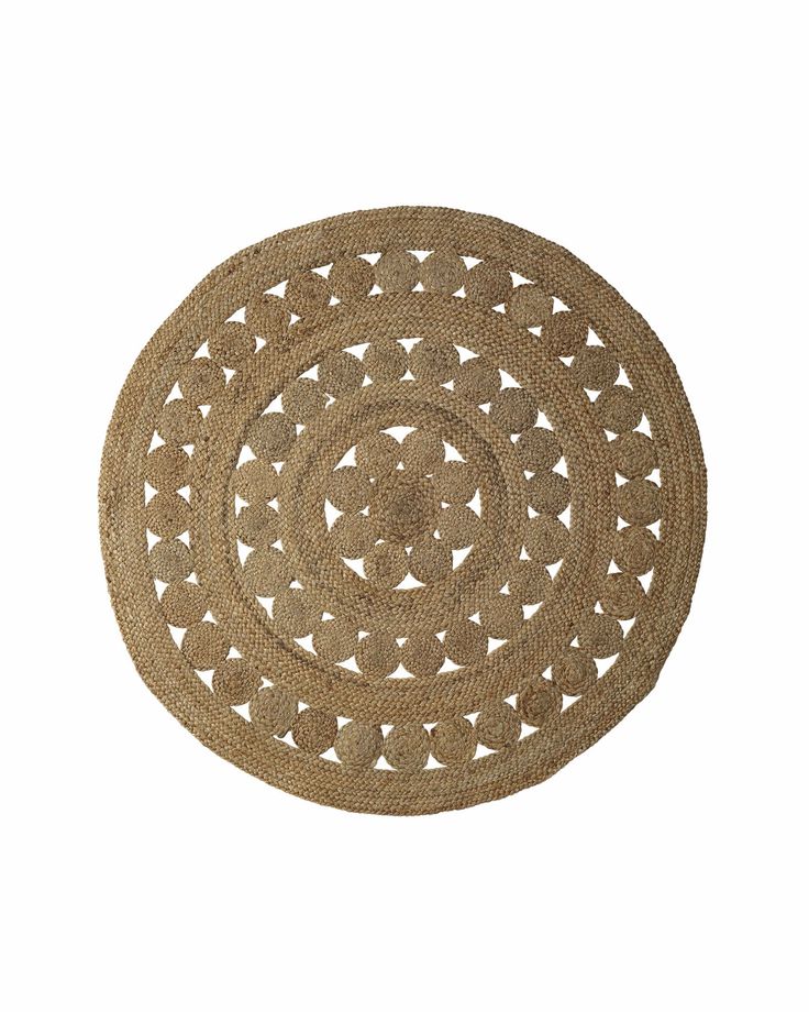 a round rug with an intricate design in the middle on a white background for use as a placemat or wall hanging