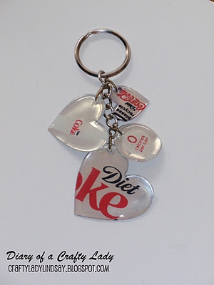 a keychain with two heart shaped tags attached to it's sides and the words we love ke