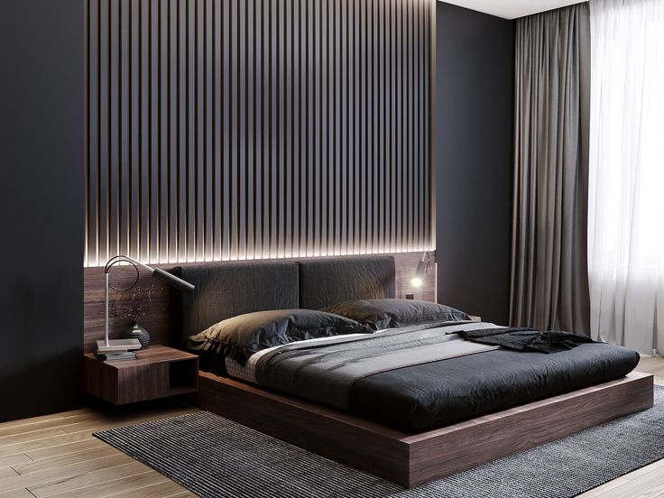 a modern bedroom with black walls and wood flooring is lit up by the lights on the headboard