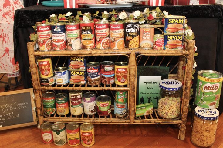 an assortment of canned food is displayed on a shelf