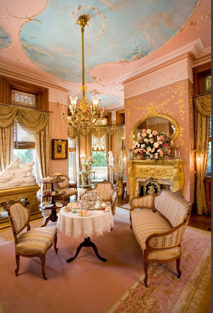 an ornately decorated living room with chandelier