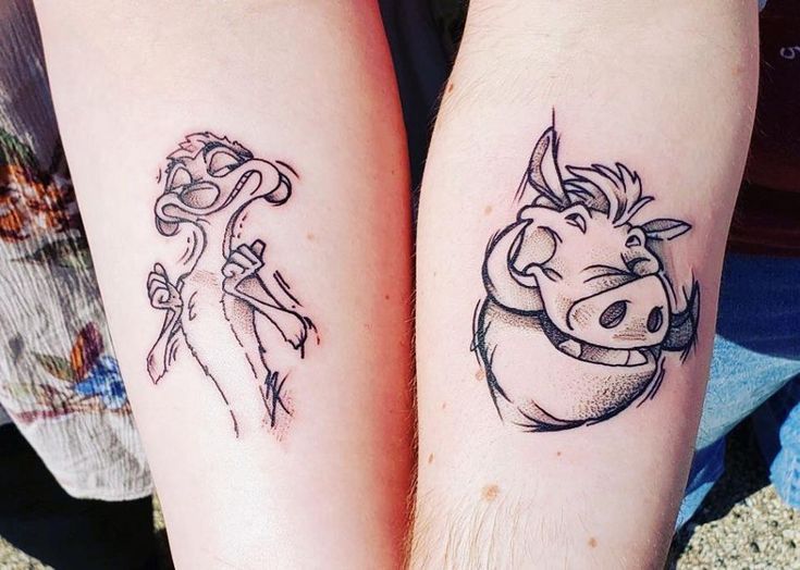 two people with tattoos on their arms, one has a pig and the other has a cow