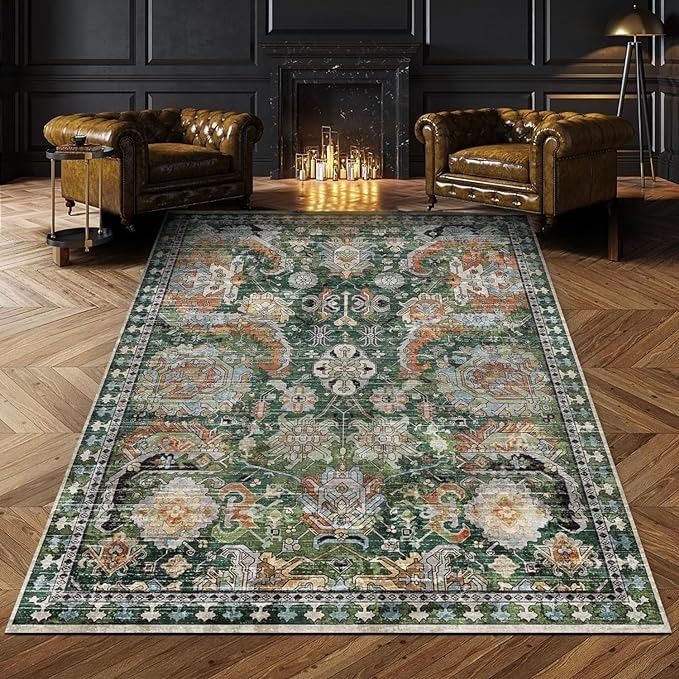 a living room filled with furniture and a rug on top of a hard wood floor