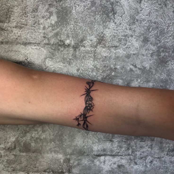 a person with a tattoo on their arm