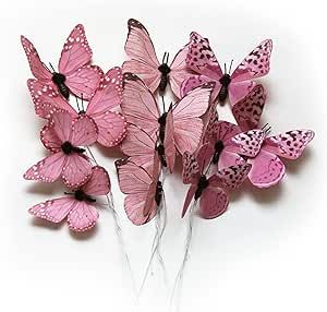 a bunch of pink butterflies sitting on top of each other